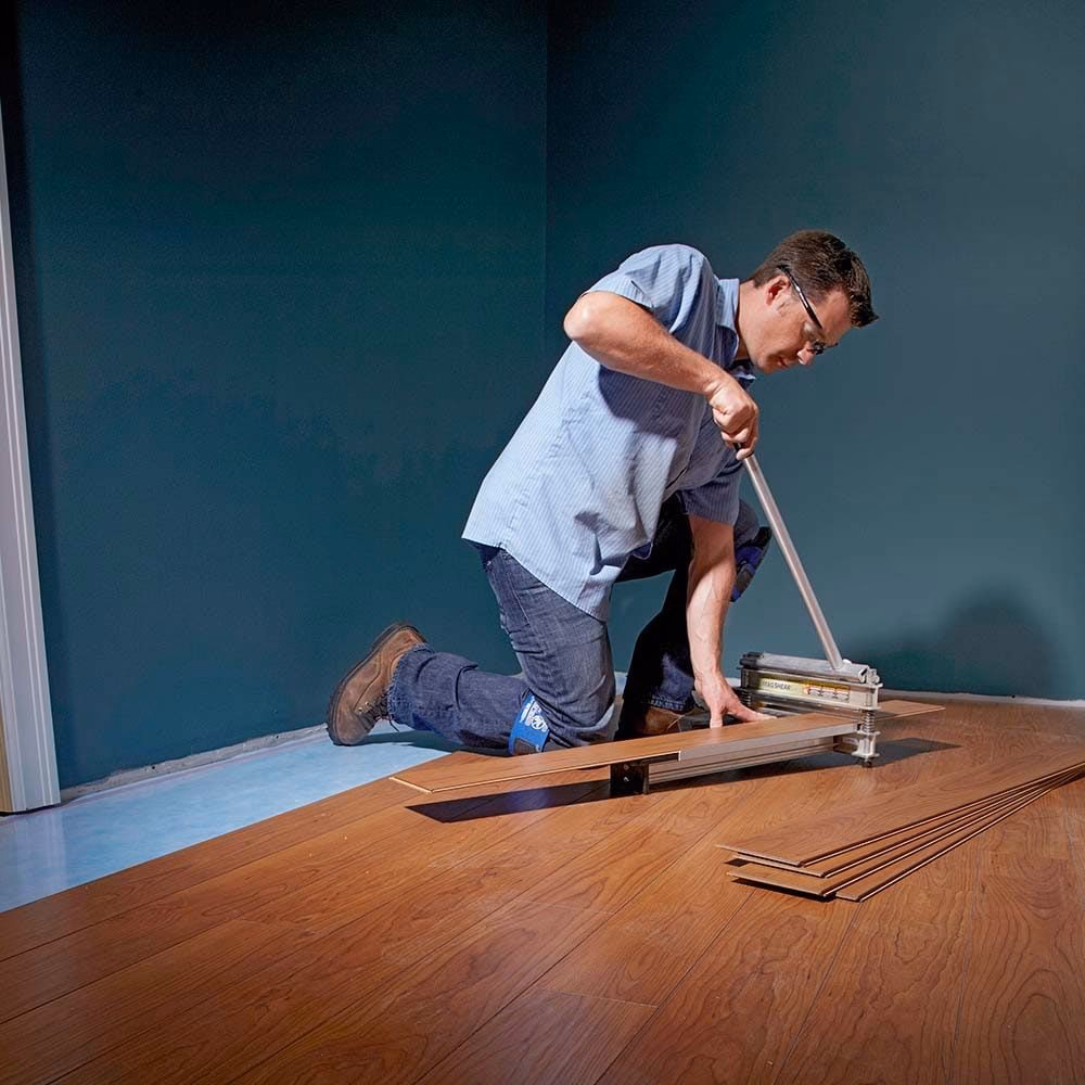 Do you need two people to lay laminate flooring?